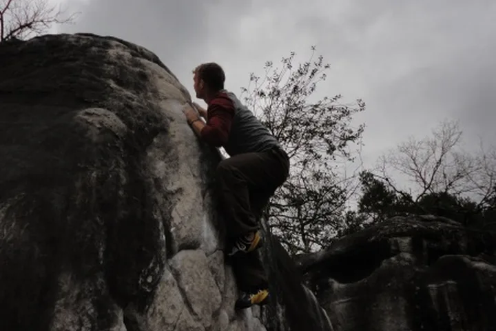 Pebble hugging in Font climbing photo